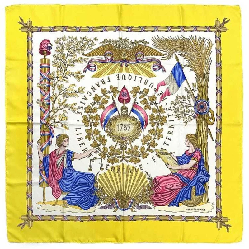 Scarves with subtle patterns -Hermes  yellow Silk Scarf (Pre-Owned)